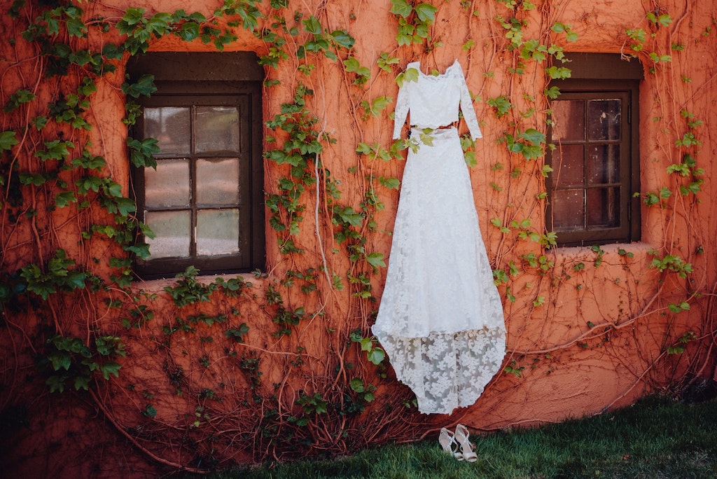 white dress in Mexico on an orange wall