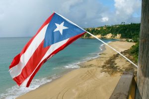 puerto rico flag over the beach, best-places-to-visit-in-puerto-rico